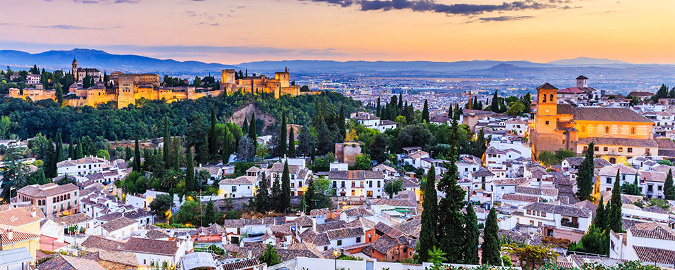 Alhambra and Granada skyline at sunset