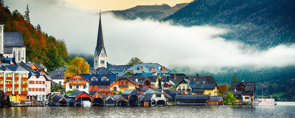 Fog over colorful houses in Hallstatt, Austria