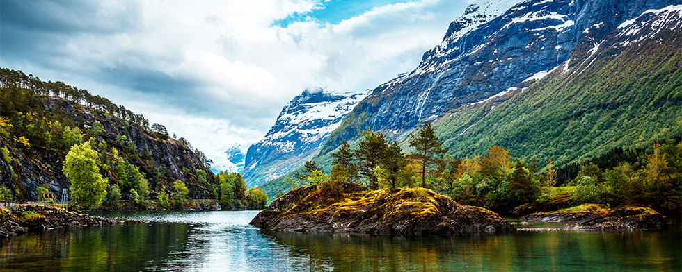 Snow-capped fjords and wooded valleys in Norway